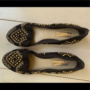 Black flats with gold embellishments
